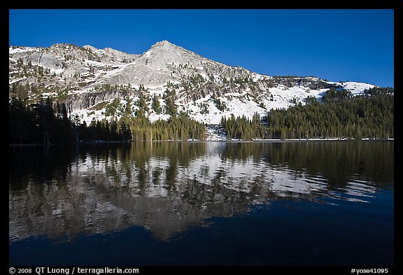 Tenaya Lake, with partly snow-covered peak reflected. Yosemite National Park (color)