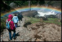 Hikers walking through rainbow, Mist Trail. Yosemite National Park ( color)