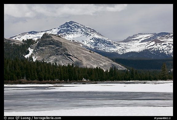 Lambert Dome surrounded by snowy peaks and meadows. Yosemite National Park, California, USA.