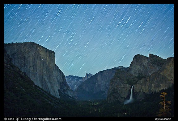 Yosemite Valley by night with star trails. Yosemite National Park, California, USA.