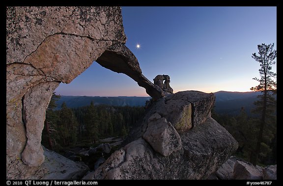 Indian Arch and moon at dusk. Yosemite National Park, California, USA.