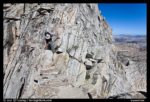 Hiker on summit block of Mount Conness. Yosemite National Park (color)