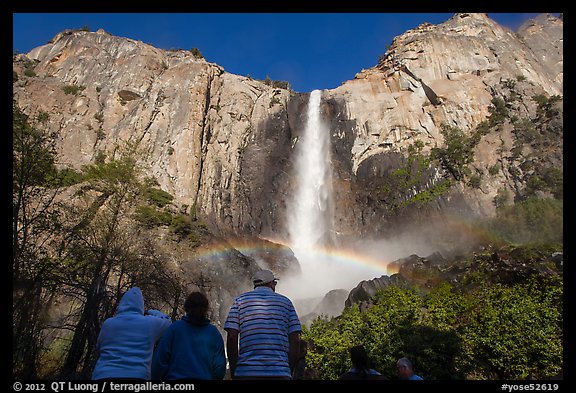 Visitors looking at Bridalvail Fall rainbow. Yosemite National Park, California, USA.