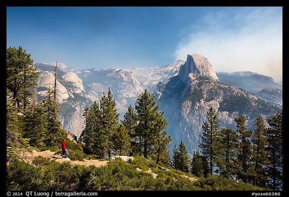 Visitor looking, Glacier Point. Yosemite National Park, California, USA.