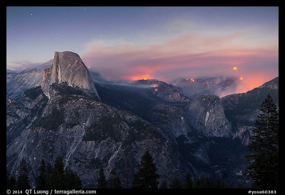 Half-Dome, forest fire, and moon rising. Yosemite National Park, California, USA.