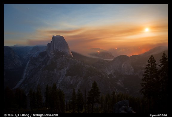 Half-Dome, wildfire, and moon. Yosemite National Park, California, USA.