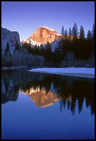 Half-Dome reflected in Merced River, winter sunset. Yosemite National Park, California, USA.