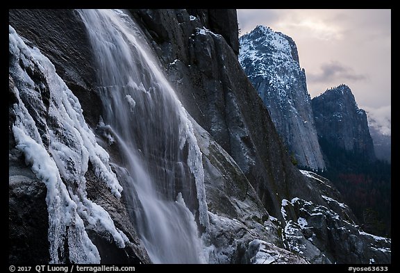 Seasonal waterfall and Cathedral Rocks in winter. Yosemite National Park, California, USA.