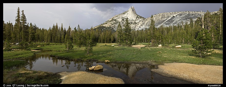 Stream and Cathedral Peak in storm light. Yosemite National Park, California, USA.