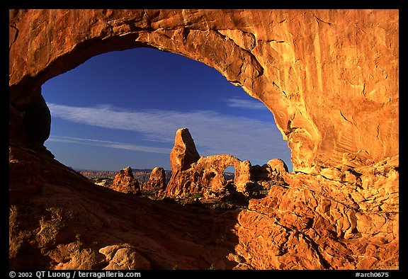 Turret Arch seen through South Window, sunrise. Arches National Park, Utah, USA.