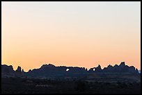 Windows Group backlit at sunrise. Arches National Park, Utah, USA. (color)