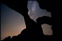 Double Arch with starry sky and Milky Way. Arches National Park, Utah, USA.