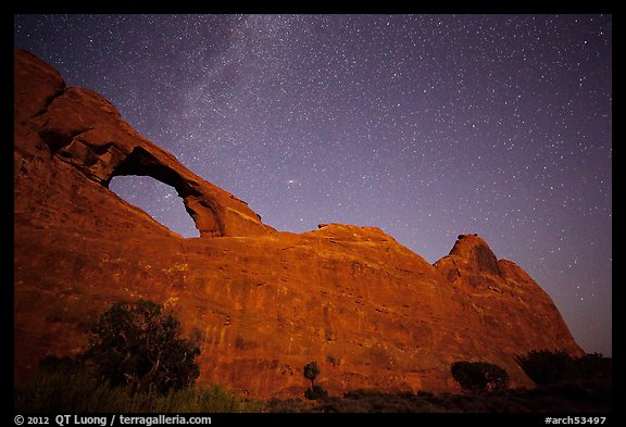 Skyline Arch at night with starry sky. Arches National Park, Utah, USA.