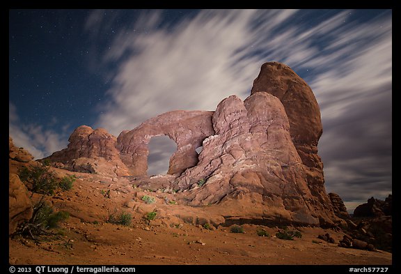Turret Arch at night, lit by light. Arches National Park, Utah, USA.