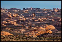 Sandstone domes with arch in background. Arches National Park ( color)