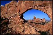 Turret Arch seen through South Window, early morning. Arches National Park, Utah, USA. (color)