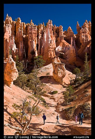 Hiker at the base of hoodoos. Bryce Canyon National Park (color)