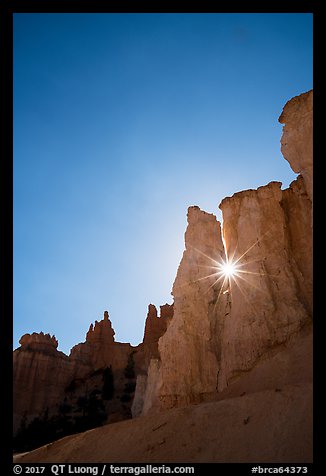 Sun star between hoodoos. Bryce Canyon National Park (color)