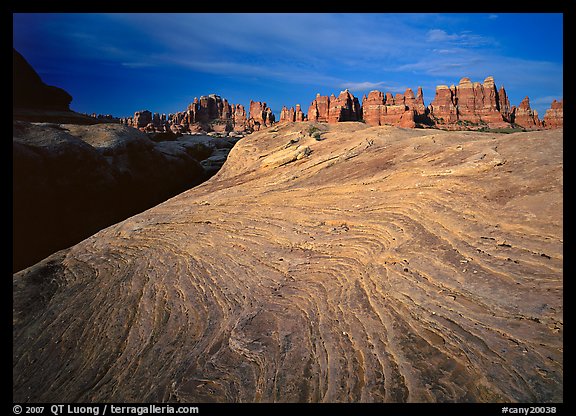 Sandstone swirls and Needles near Elephant Hill at sunrise, the Needles. Canyonlands National Park (color)