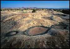 Empty pot holes on sandstone, Needles District. Canyonlands National Park ( color)