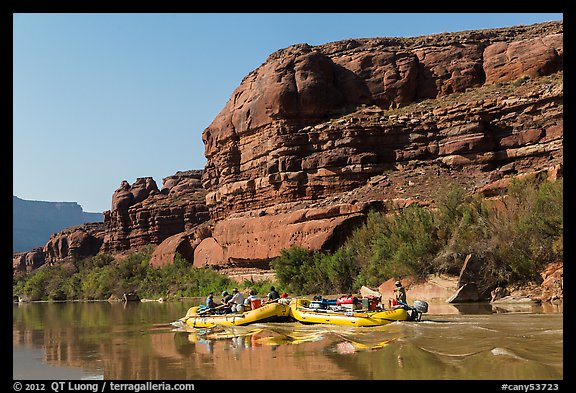 Rafts motoring upstream Colorado River. Canyonlands National Park, Utah, USA.