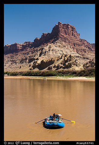 Woman paddling raft on Colorado River. Canyonlands National Park, Utah, USA.