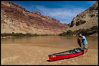 Canoeist and canoe near Confluence. Canyonlands National Park, Utah, USA. (color)