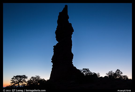 Standing Rock silhouette at sunrise. Canyonlands National Park, Utah, USA.