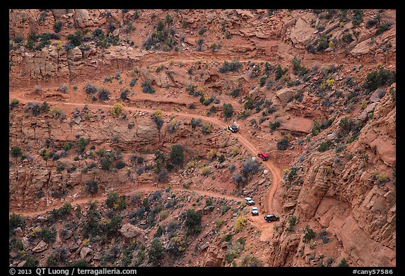 Jeep caravan negotiates hairpin turn on the Flint Trail,  Orange Cliffs Unit, Glen Canyon National Recreation Area, Utah. USA (color)