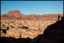 Hiker silhouette above the Maze and Chocolate drops. Canyonlands National Park ( color)
