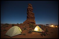 Camp at the base of Standing Rock at night. Canyonlands National Park, Utah, USA.