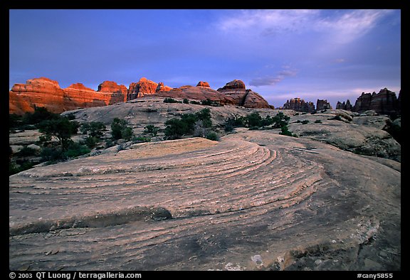 Sandstone swirls and Needles with last light, the Needles. Canyonlands National Park (color)