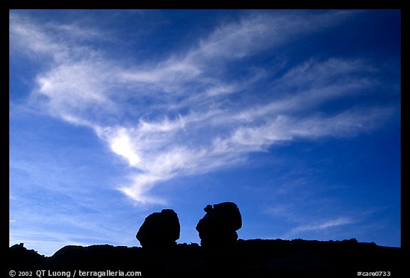 Twin boulders and clouds, dusk. Capitol Reef National Park, Utah, USA.