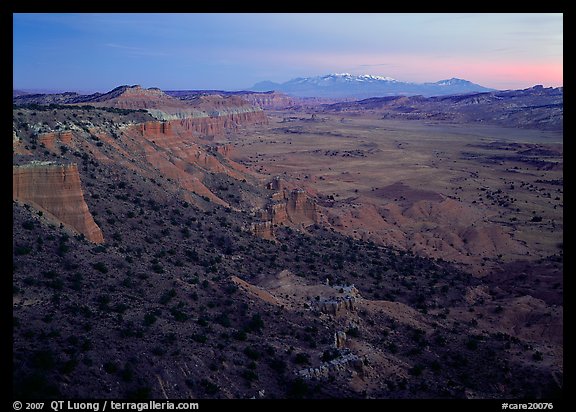 Cliffs, basin, and snowy mountains at dusk, Upper Desert, dusk. Capitol Reef National Park (color)