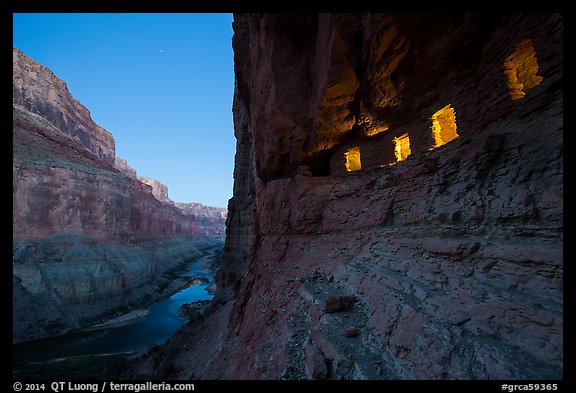 Ancient Nankoweap granaries with windows lit and Colorado River at dusk. Grand Canyon National Park (color)