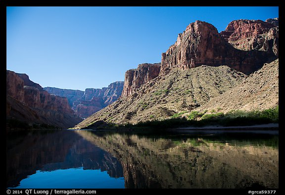 Buttes and glassy reflections in Colorado River. Grand Canyon National Park, Arizona, USA.