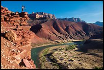 Photographer on steep cliff above Unkar rapids. Grand Canyon National Park ( color)