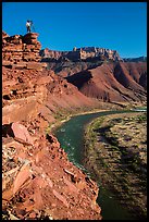 Photographer on sheer cliff above Unkar rapids. Grand Canyon National Park ( color)