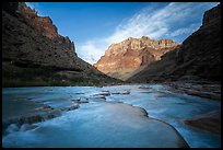 Turquoise water from the Little Colorado River flows over travertine terraces in the early morning. Grand Canyon National Park ( color)