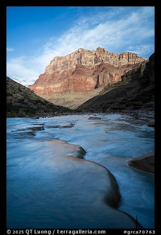 The blue-green Little Colorado River flowing beneath massive cliffs in the early morning. Grand Canyon National Park (color)