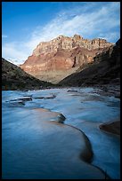 The blue-green Little Colorado River flowing beneath massive cliffs in the early morning. Grand Canyon National Park ( color)