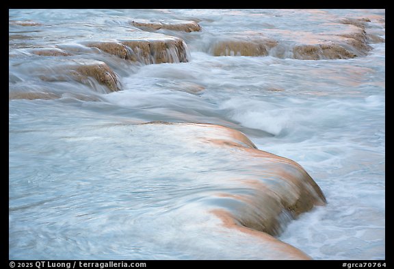 Travertine terraces sculpted by mineral-rich waters create a striking texture along the turquoise streambed of the Little Colorado River. Grand Canyon National Park (color)