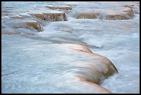 Travertine terraces sculpted by mineral-rich waters create a striking texture along the turquoise streambed of the Little Colorado River. Grand Canyon National Park ( color)
