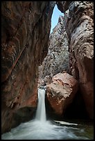 Shinumo Creek cascades into a natural plunge pool beneath towering rock walls. Grand Canyon National Park ( color)