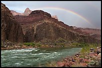 A rainbow arches above rapids after a passing storm clears the canyon skies. Grand Canyon National Park ( color)