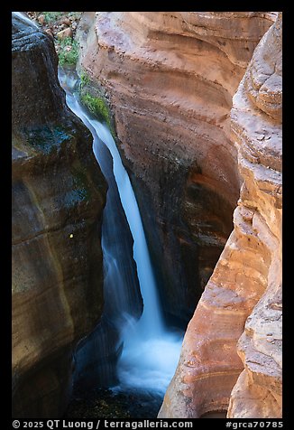 A waterfall in Deer Creek plunges into a narrow chasm.. Grand Canyon National Park (color)