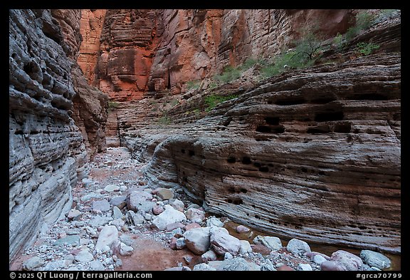 Layered walls of National Canyon bear signs of water scouring and pockmarks. Grand Canyon National Park (color)