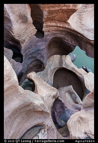 Water-sculpted potholes carved in a surreal swirl of pastel-colored rock. Grand Canyon National Park (color)