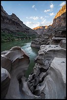Evening light grazes the rim above a sculpted alcove along the riverbank. Grand Canyon National Park ( color)