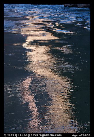 Glowing reflections streak the river's surface in ribbons of light. Grand Canyon National Park (color)